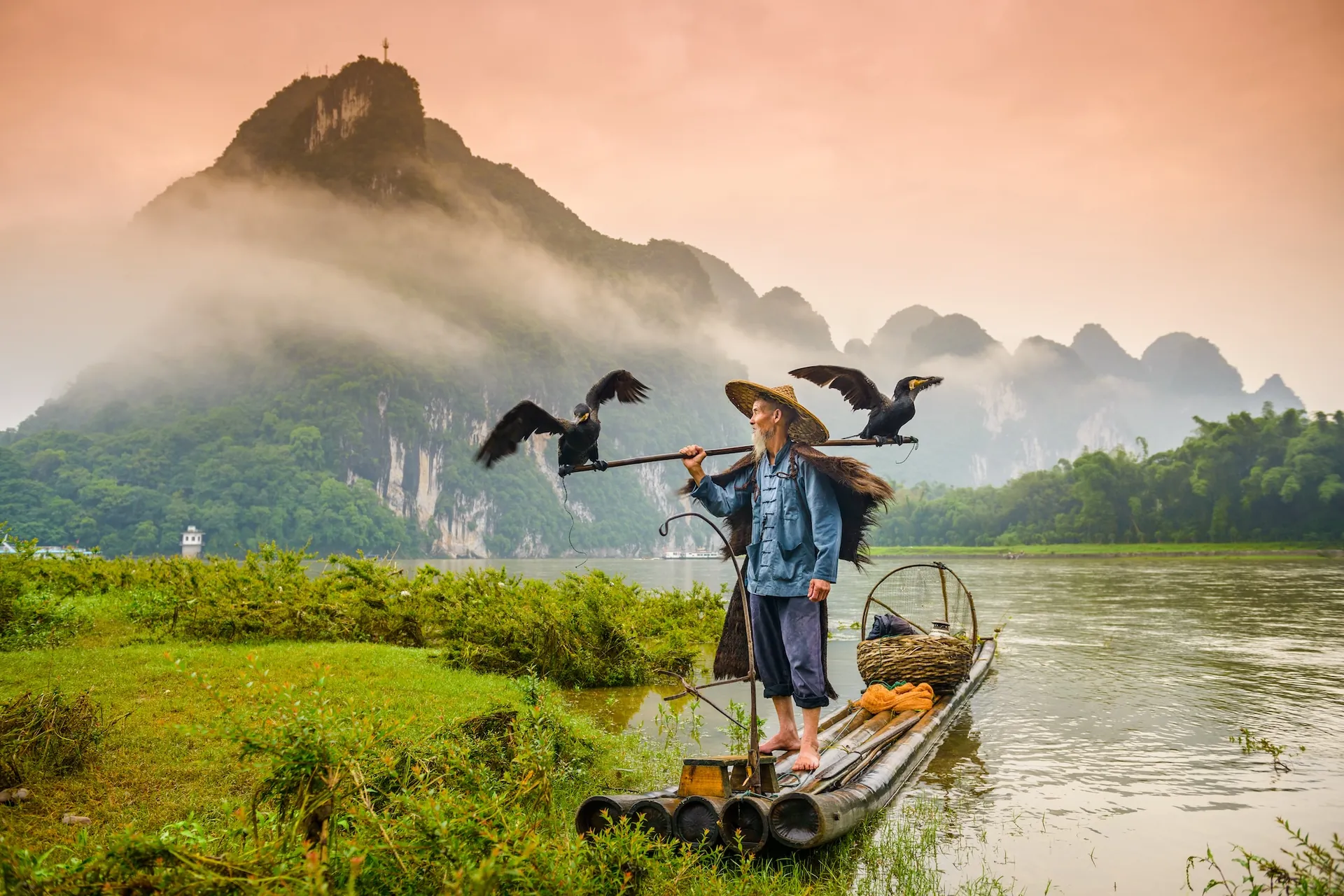 A cormorant fisherman on the Li River, Guilin