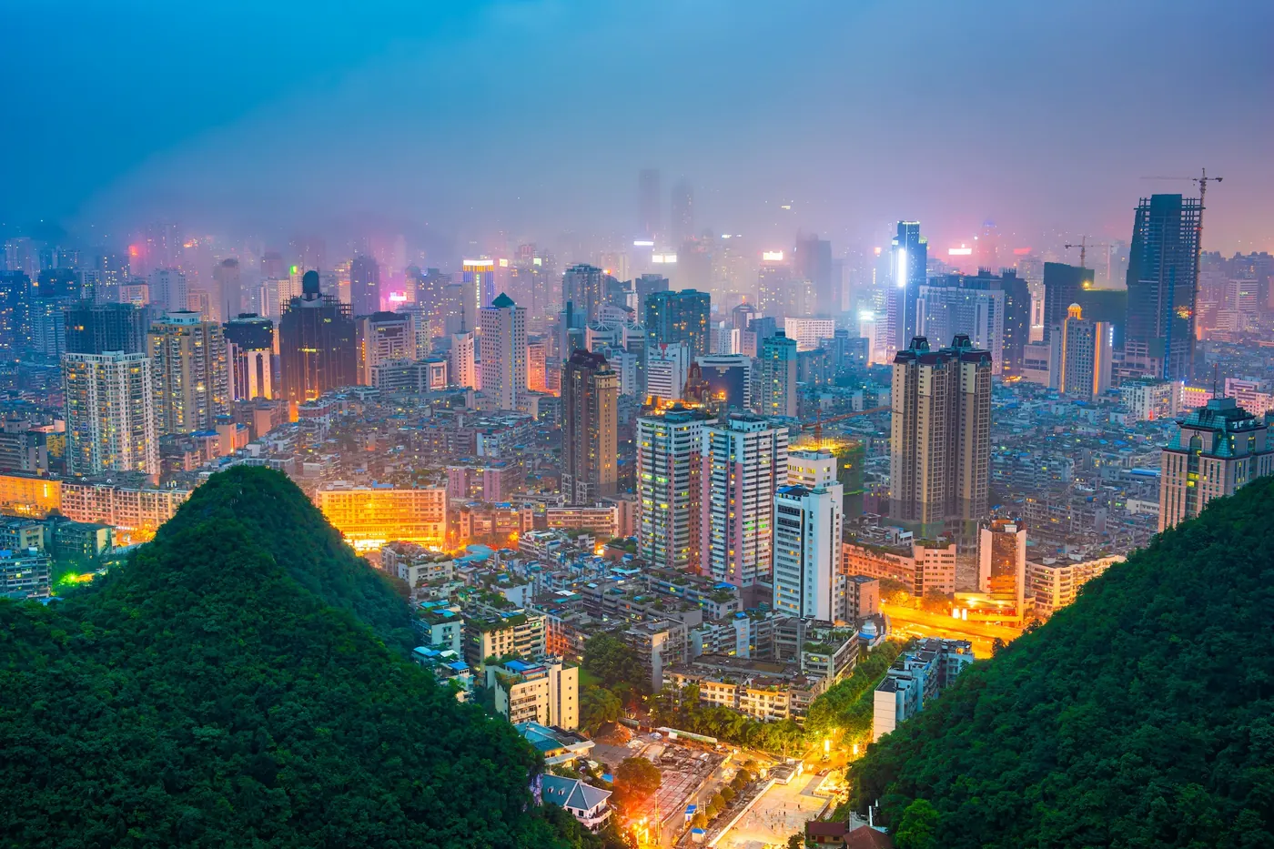 Guiyang, capital of Guizhou, at dusk among the karst hills that run through the city