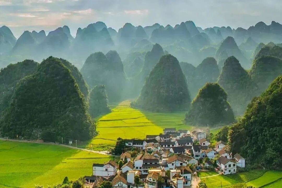 Farmland and a village between Guizhou’s karst hills