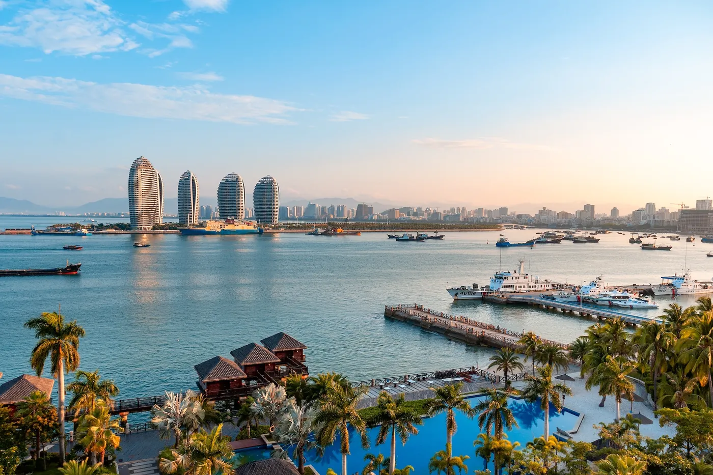 Sanya bay at sunrise with the Phoenix Island towers behind, Hainan