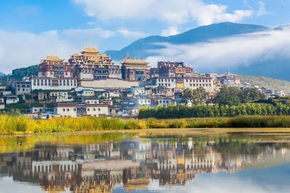 Songzanlin Monastery reflected in the lake, Shangri-La, Yunnan