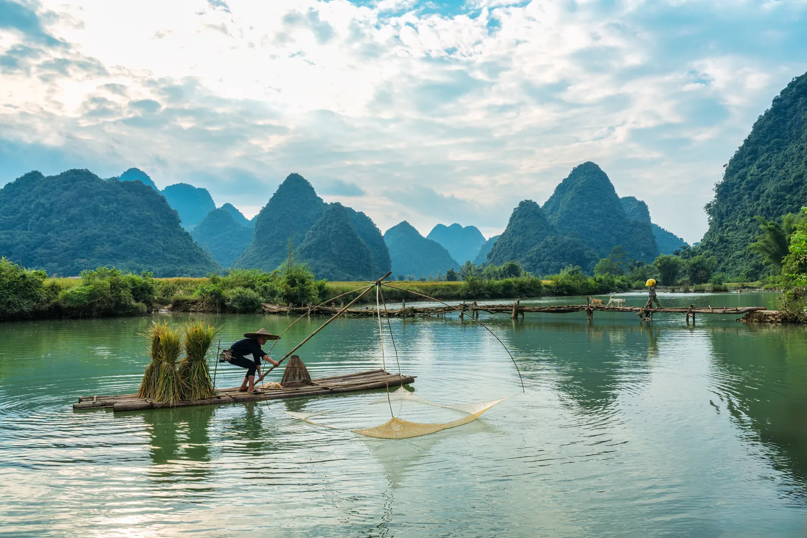 A fisherman on a bamboo raft