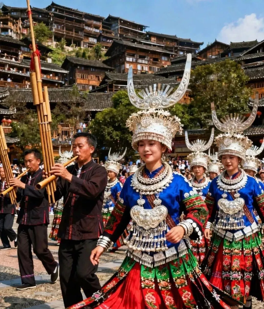 Miao women in silver headdresses at a festival